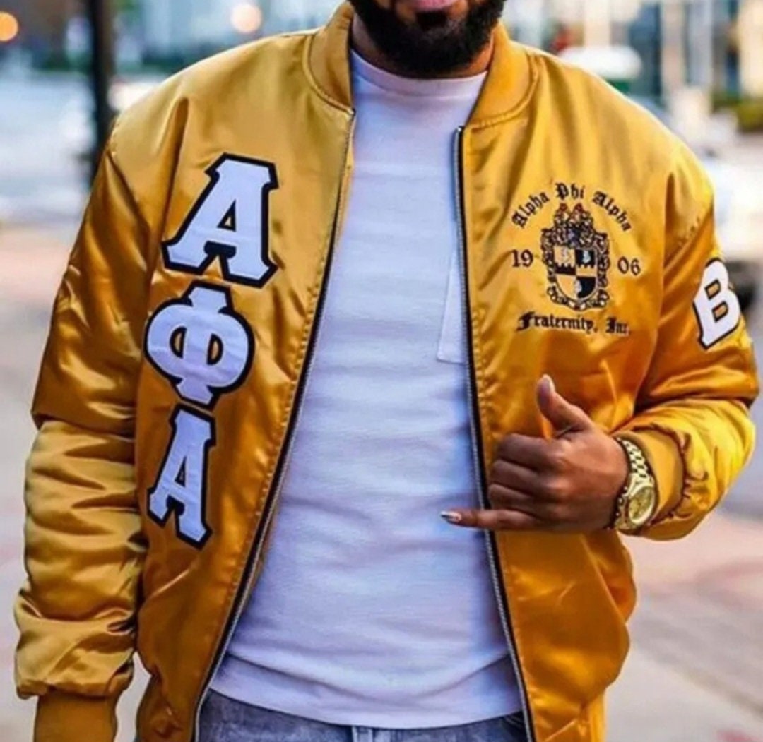 Front view of yellow Alpha Phi Alpha bomber jacket with Greek-letter embroidery and chest emblem