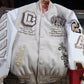 AC Milan-inspired Off-White varsity jacket on a hanger, showing the front patches