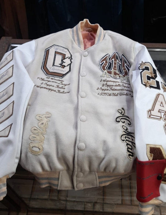 AC Milan-inspired Off-White varsity jacket on a hanger, showing the front patches