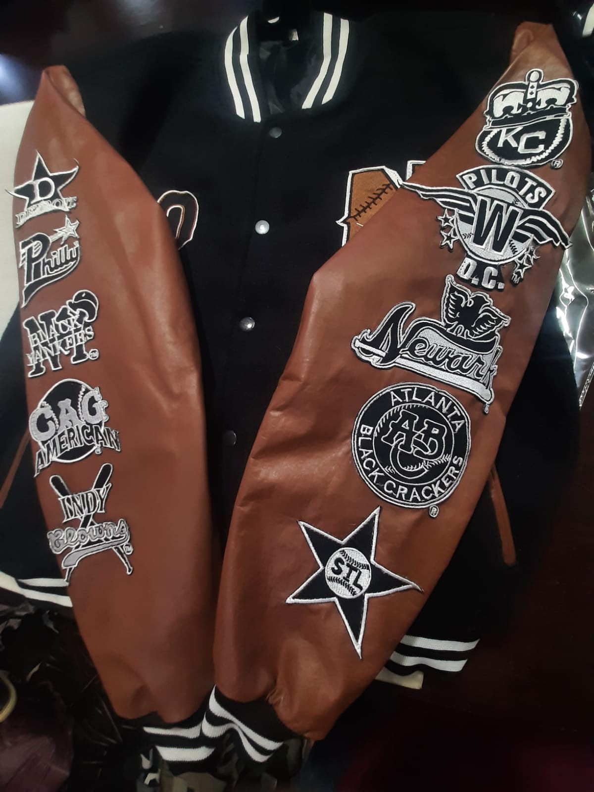 Front and sleeve embroidery details on the Negro League Baseball S9 varsity jacket